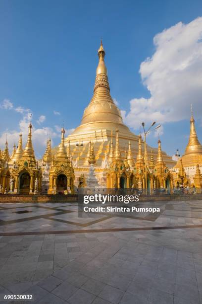 shwedagon pagoda with blue sky yangon, myanmar - shwedagon pagoda stock pictures, royalty-free photos & images