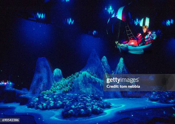 View of an unidentified woman and child as they ride the suspended Peter Pan's Flight attraction at Disneyland, Anaheim, California, September 1962.