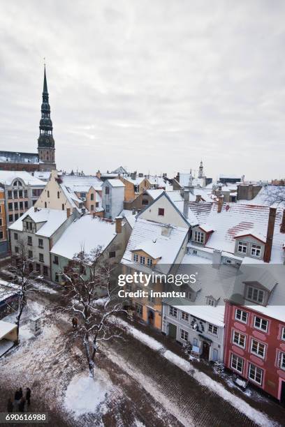 old town riga in winter - livu square stock pictures, royalty-free photos & images