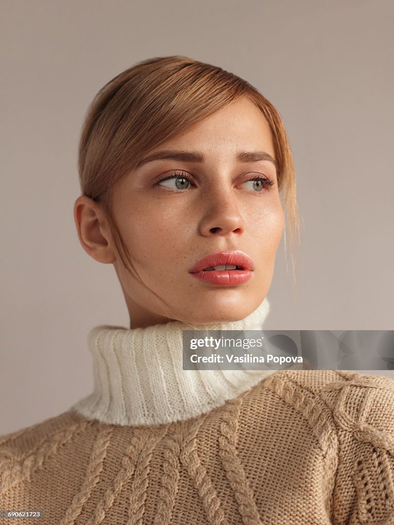 Young beautiful woman in knitwear