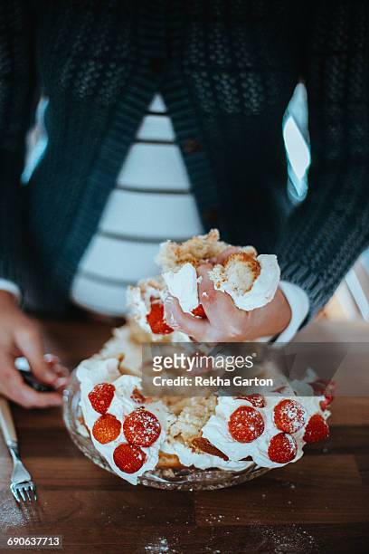 woman holding a piece of cake - rekha garton stock pictures, royalty-free photos & images