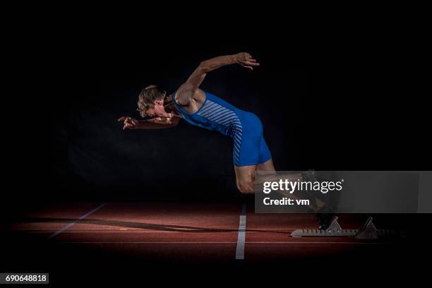 Male Sprinters On Starting Blocks Side View Photos and Premium High Res ...