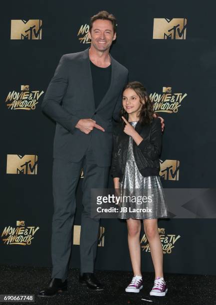 Hugh Jackman and Dafne Keen pose in the press room at the 2017 MTV Movie and TV Awards at The Shrine Auditorium on May 7, 2017 in Los Angeles,...
