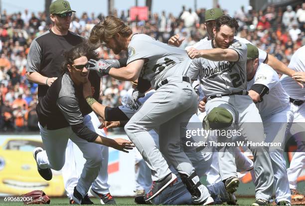 Jeff Samardzija of the San Francisco Giants goes after Bryce Harper of the Washington Nationals after Harper charged the mound from being hit by a...