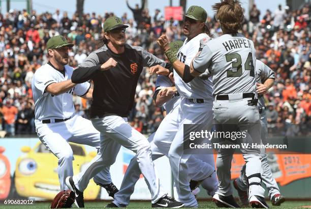 Jeff Samardzija of the San Francisco Giants goes after Bryce Harper of the Washington Nationals after Harper charged the mound from being hit by a...