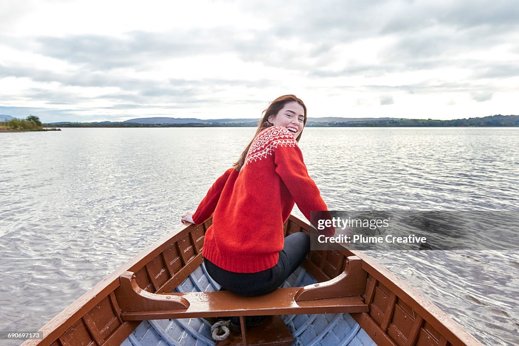 Woman smiling in a row boat