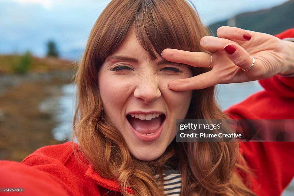 Young woman taking selfie