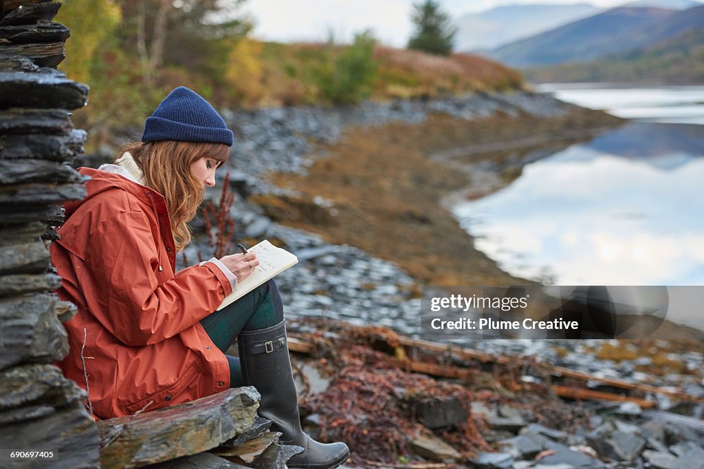 Woman writing in a journal