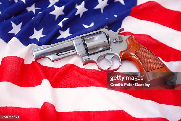 magnum hand gun on stars and stripes flag - american flag gun stock pictures, royalty-free photos & images