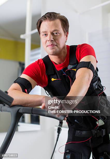 ems - electrical muscle stimulation - nmes - ems forster productions stock pictures, royalty-free photos & images