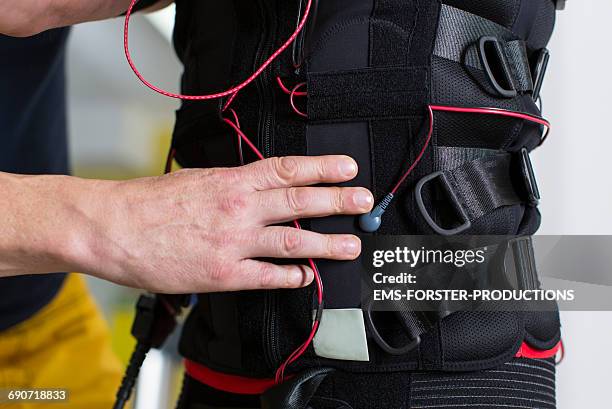 ems - electrical muscle stimulation - nmes - ems forster productions stock pictures, royalty-free photos & images