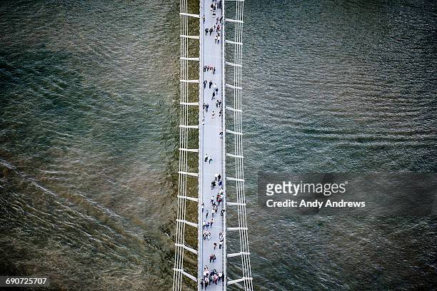 millennium bridge over the river thames - aerial view london stock-fotos und bilder