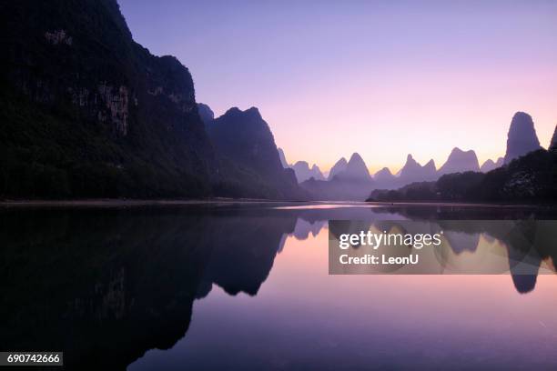 mountain reflections at dawn, guilin, china - dawn beach stock pictures, royalty-free photos & images