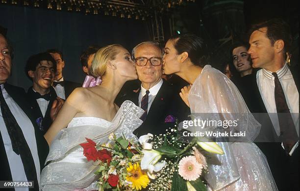 Pierre Cardin's fashion show at the Red Square in Moscow, Russia, in June 1991. Pictured: models kissing Pierre Cardin.