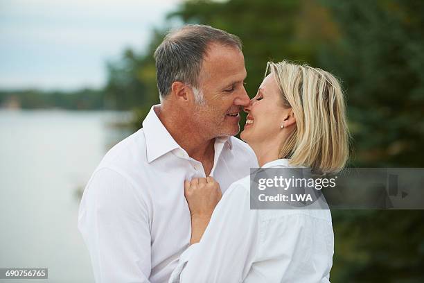 couple about to kiss - 2015 45 50 stock pictures, royalty-free photos & images