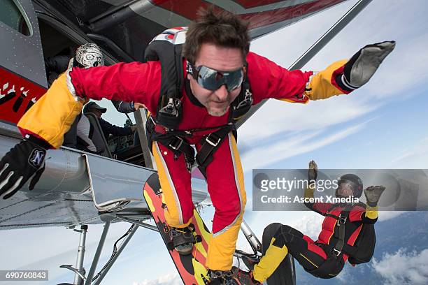 sky surfer in freefall from fixed wing plane - wing suit stock pictures, royalty-free photos & images
