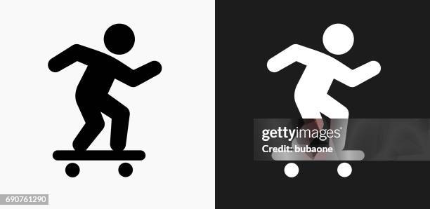 skateboarding icon on black and white vector backgrounds - skateboard icon stock illustrations