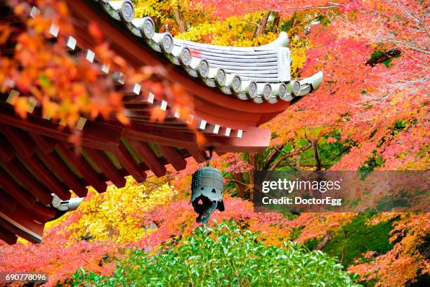 bell on the roof with autumn maple leaves background - daigoji stock pictures, royalty-free photos & images