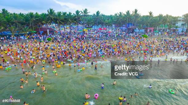 Aerial view of crowd at beach on May 30, 2017 in Haikou, Hainan Province of China. Thousands of people came to the beach in Haikou on the Dragon Boat...