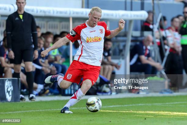 Uwe Hesse of Jahn Regensburg controls the ball during the Second Bundesliga Playoff first leg match between Jahn Regensburg and TSV 1860 Muenchen at...