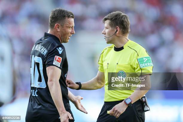 Ivica Olic of 1860 Munich speak with Referee Patrick Ittrich during the Second Bundesliga Playoff first leg match between Jahn Regensburg and TSV...