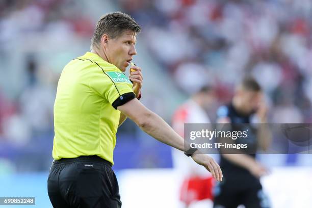 Referee Patrick Ittrich looks on during the Second Bundesliga Playoff first leg match between Jahn Regensburg and TSV 1860 Muenchen at Continental...