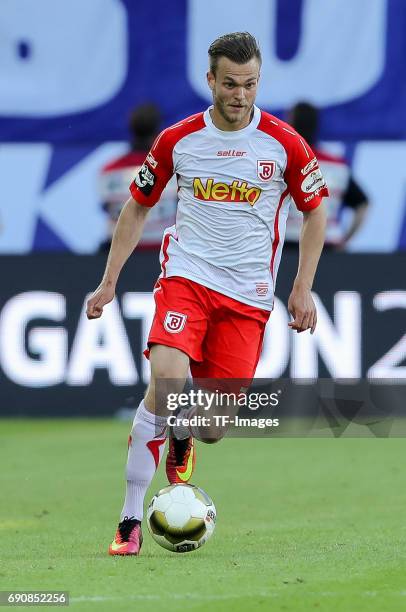 Benedikt Saller of Jahn Regensburg controls the ball during the Second Bundesliga Playoff first leg match between Jahn Regensburg and TSV 1860...