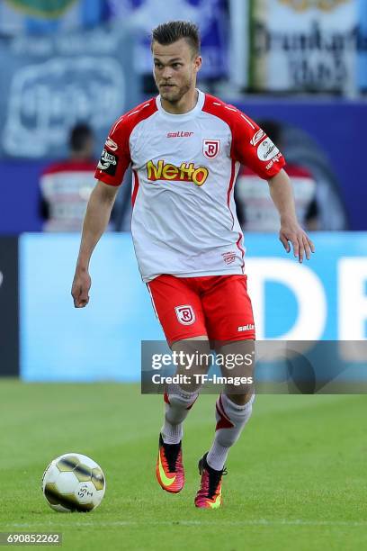 Benedikt Saller of Jahn Regensburg controls the ball during the Second Bundesliga Playoff first leg match between Jahn Regensburg and TSV 1860...