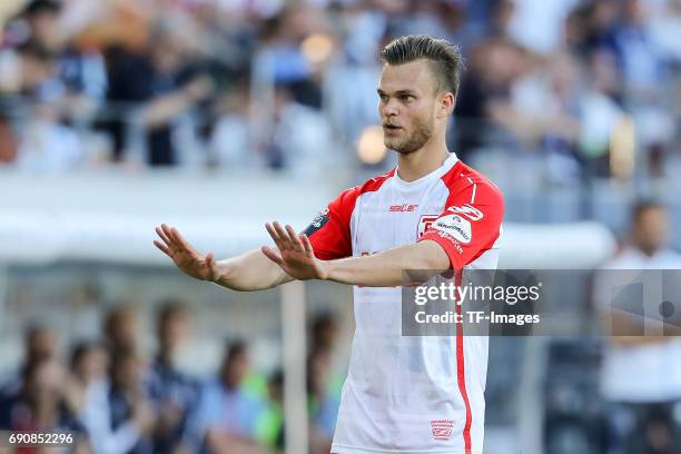 Benedikt Saller of Jahn Regensburg gestures during the Second Bundesliga Playoff first leg match between Jahn Regensburg and TSV 1860 Muenchen at...