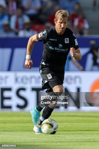 Stefan Aigner of 1860 Munich controls the ball during the Second Bundesliga Playoff first leg match between Jahn Regensburg and TSV 1860 Muenchen at...