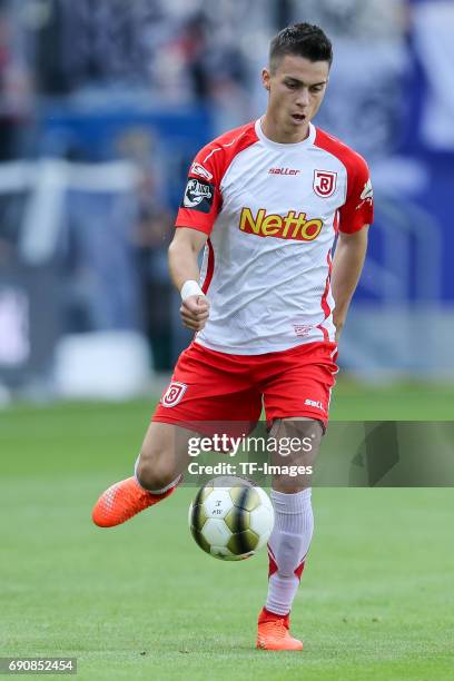 Erik Thommy of Jahn Regensburg controls the ball during the Second Bundesliga Playoff first leg match between Jahn Regensburg and TSV 1860 Muenchen...