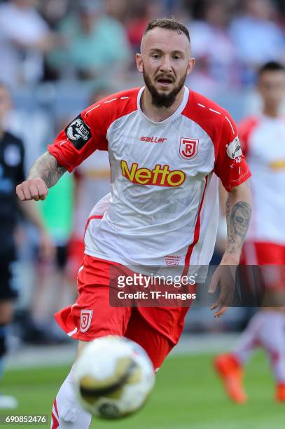 Marvin Knoll of Jahn Regensburg controls the ball during the Second Bundesliga Playoff first leg match between Jahn Regensburg and TSV 1860 Muenchen...