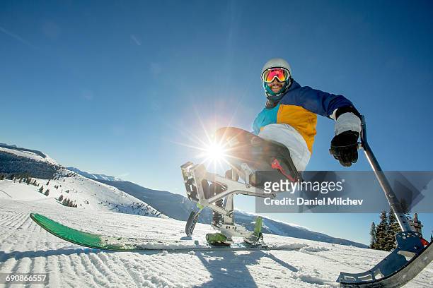 lifestyle of a man with differing abilities. - wintersport stock-fotos und bilder