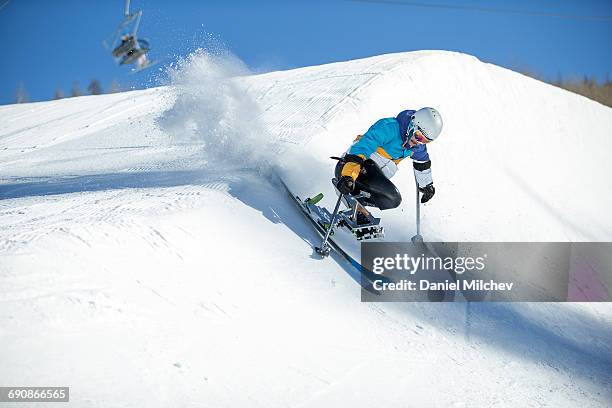 guy with differing abilitie riding a half-pipe. - disabled winter sport stock pictures, royalty-free photos & images