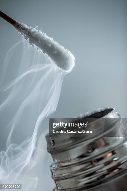 cryotherapy using cotton swab and liquid nitrogen - liquid nitrogen stock pictures, royalty-free photos & images