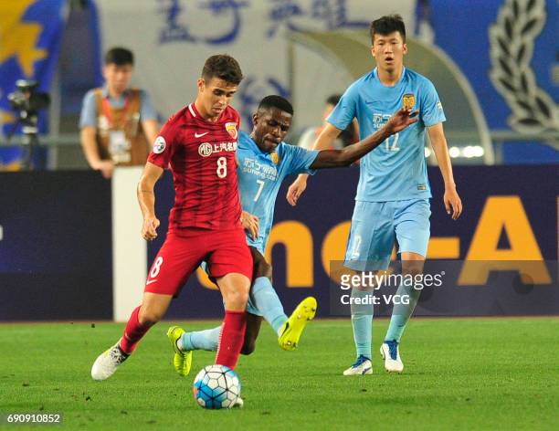 Oscar of Shanghai SIPG and Ramires of Jiang Suning compete for the ball during 2017 AFC Champions League Round of 16 between Jiangsu Suning and...
