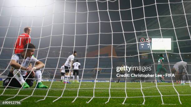 Phil Neumann of Germany and team mates look dejected as Zambia celebrate their fourth and winning goal during the FIFA U-20 World Cup Korea Republic...