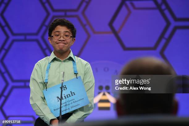 Minh Nguyen of Gilberts, Illinois, reacts as he tries to spell his word during round two of 2017 Scripps National Spelling Bee at Gaylord National...