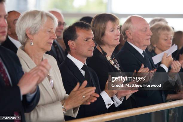 Secretary of State for Wales Alun Cairns claps with Labour politician Harriet Harman and Neil Kinnock during the funeral of former First Minister of...