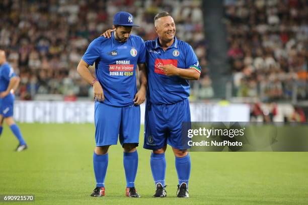 Paolo Belli with an anonymous field invader during the twenty-sixth Partita del Cuore charity football game at Juventus Stadium on may 30, 2017 in...