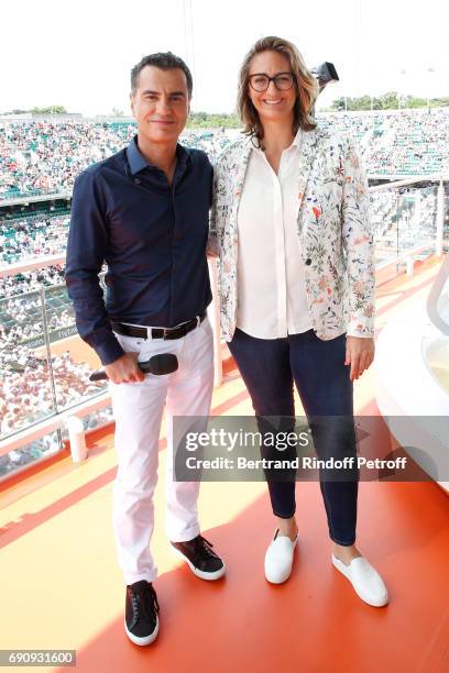 Sports Journalist Laurent Luyat and Consultant of 'France Television', Mary Pierce pose during the 2017 French Tennis Open - Day Four at Roland...