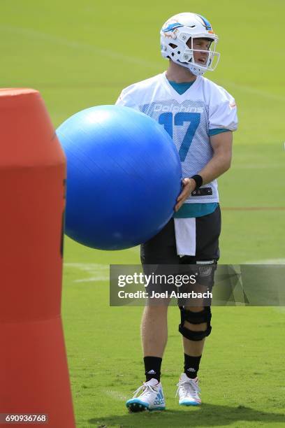 Ryan Tannehill of the Miami Dolphins runs a drill during the teams OTA's on May 31, 2017 at the Miami Dolphins training facility in Davie, Florida.