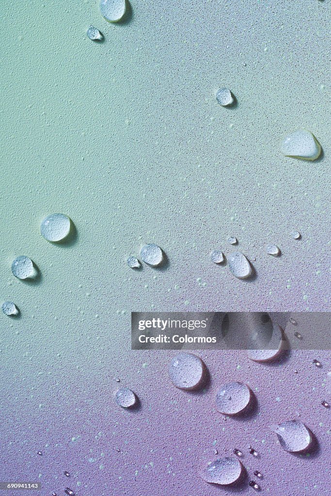 Water droplets on soft colored background
