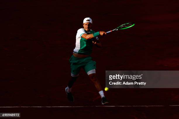 Lucas Pouille of France plays a forehand during the mens singles second round match against Thomaz Bellucci of Brazil on day four of the 2017 French...