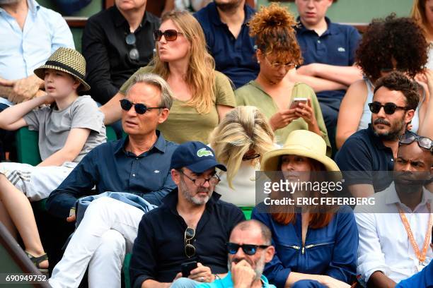 French comedian Bruno Lassalle and his wife French makeup artist Veronique Clochepain attend the tennis match between Spain's Rafael Nadal and...