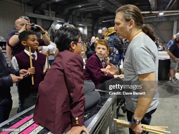 Eric Singer of KISS meets School Of Rock: The Musical" cast members Cole Lam, Bailey Cassell, Eliza Cowdery and Toby Lee backstage at The O2 Arena on...