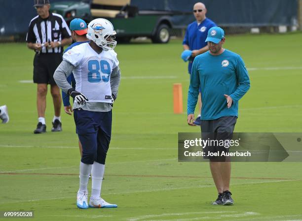 Head coach Adam Gase directs Julius Thomas of the Miami Dolphins during the teams OTA's on May 31, 2017 at the Miami Dolphins training facility in...