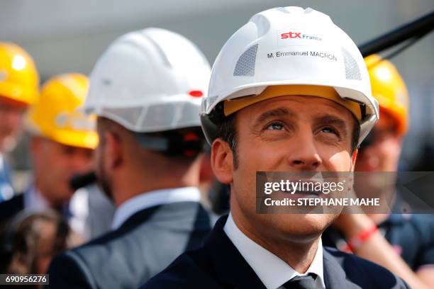 French President Emmanuel Macron visits the MSC Meraviglia cruise ship during the delivery ceremony of the boat on May 31, 2017 at the STX shipyard...