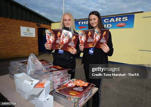Volunteers hand out Panini sticker albums during the WSL 1 match between Birmingham City Ladies and Yeovil Town Ladies FC on May 31, 2017 in...