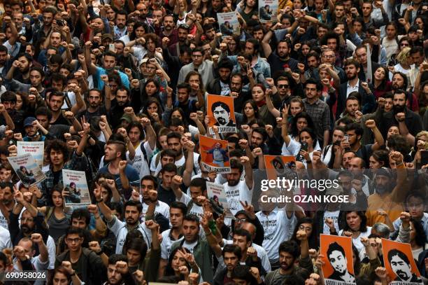 Demonstrators display banners as they march past on May 31, 2017 in Istanbul, on the fourth anniversary of the start of the Gezi Park protests. The...